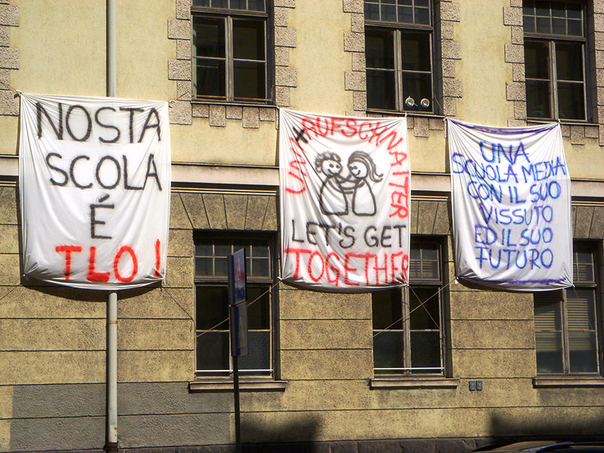 Protest signs outside school in Bozen-Bolzano, Italy